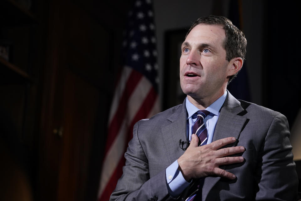 Rep. Jason Crow, D-Colo., talks during an interview with The Associated Press in his office on Capitol Hill in Washington, Wednesday, Dec. 15, 2021, looking back a year later at his experience during the Jan. 6 Capitol insurrection. (AP Photo/Susan Walsh)