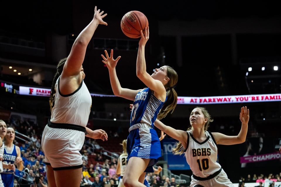 Newell-Fonda's Isabel Bartek (13) shoots the ball during the Class 1A Iowa girls state basketball championship between Newell-Fonda and Bishop Garrigan, on Saturday, March 4, 2023, at Wells Fargo Arena in Des Moines. 