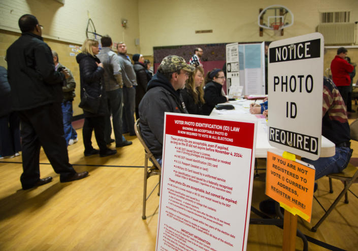 <p>Voters take to the polls on April 5, 2016, in Wauwatosa, Wis. Republicans and Democrats both cast their votes in today’s presidential primaries. <i>(Photo: Darren Hauck/Getty Images)</i></p>