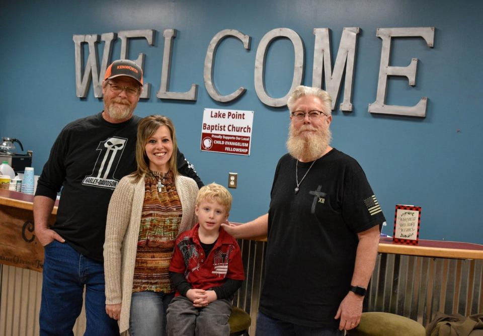 Heather Brooks, second from left, received help with her donation project from, left to right, her husband Tom Brooks, her son Brenden Brooks, and Pastor Lloyd McCarroll.