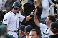 DETROIT, MI - OCTOBER 13: Alex Avila #13 of the Detroit Tigers celebrates in the dugout with Justin Verlander #36 after hitting a solo home run in the third inning of Game Five of the American League Championship Series against the Texas Rangers at Comerica Park on October 13, 2011 in Detroit, Michigan. (Photo by Harry How/Getty Images)