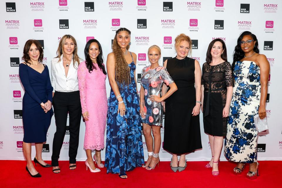 a group of women posing for a photo