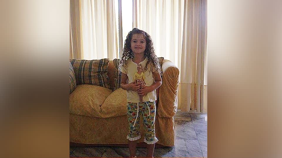 Bárbara "Barbi" Miranda as a girl, holding one of her many Barbies. - Courtesy Barbara Miranda