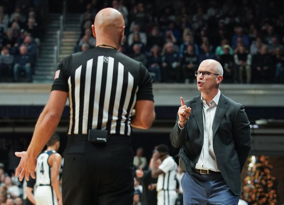 Connecticut Huskies head coach Dan Hurley talks to a referee during the first half against the Butler Bulldogs at Hinkle Fieldhouse.