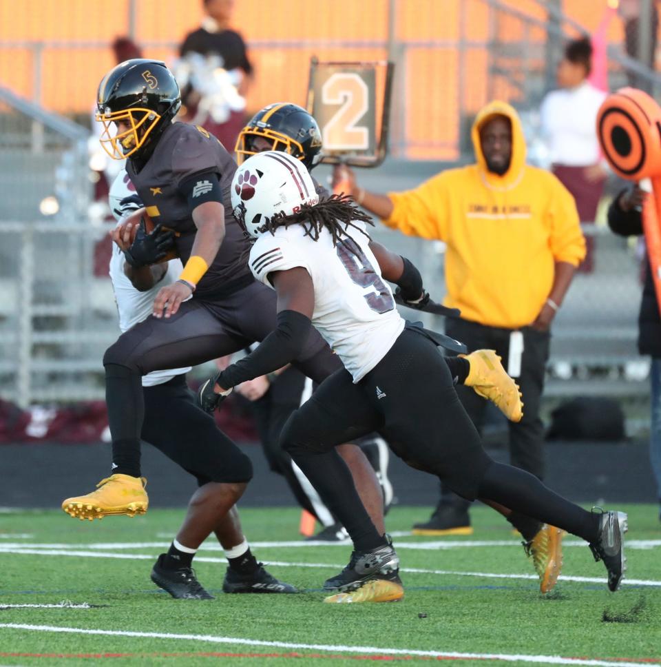 Detroit King quarterback Dante Moore (5) runs the ball against River Rouge during first-half action on Friday, Oct. 28, 2022.