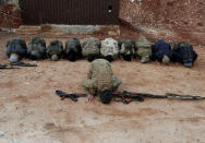 <p>Turkey-backed Free Syrian Army fighters pray at a training camp in Azaz, Syria, Jan. 21, 2018. (Photo: Osman Orsal/Reuters) </p>