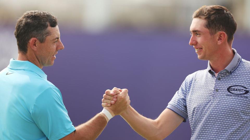 McKibbin shakes hands with Rory McIlroy after a practice round in Dubai last November