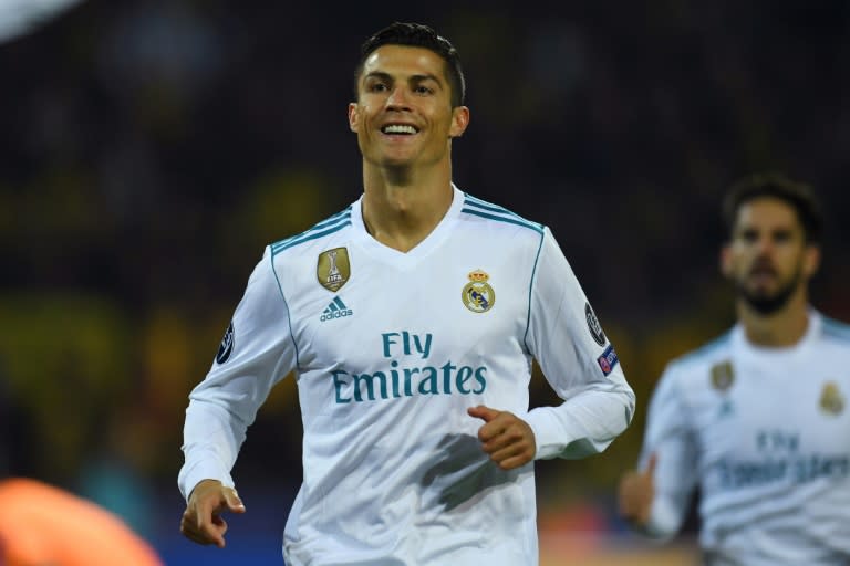 Real Madrid's forward Cristiano Ronaldo celebrates scoring with his teammates during the UEFA Champions League Group H football match against BVB Borussia Dortmund September 26, 2017