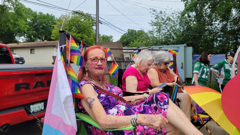 Rose Kuntz, a 69-year-old transgender woman, sits in a trailer as she participates in her first Pride parade.