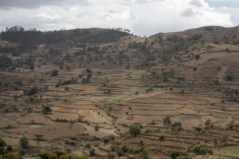 Terraced hills are seen off the road between Gondar and Danshe, a town in an area of western Tigray annexed by the Amhara region during the ongoing conflict, in Ethiopia Saturday, May 1, 2021. Ethiopia faces a growing crisis of ethnic nationalism that some fear could tear Africa's second most populous country apart, six months after the government launched a military operation in the Tigray region to capture its fugitive leaders. (AP Photo/Ben Curtis)