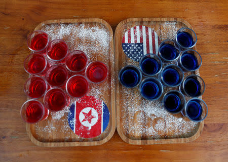 Special red and blue shots offered at Escobar bar to mark the summit meeting between U.S. President Donald Trump and North Korean leader Kim Jong Un, are displayed on a table in Singapore June 4, 2018. REUTERS/Edgar Su