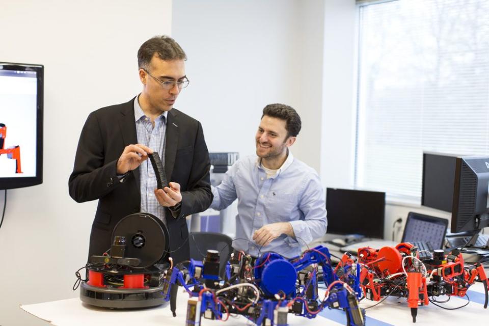 Dalloro holding a plastic object built by the bots. <span class="inline-image-credit">(Siemens Corporate Technology)</span>