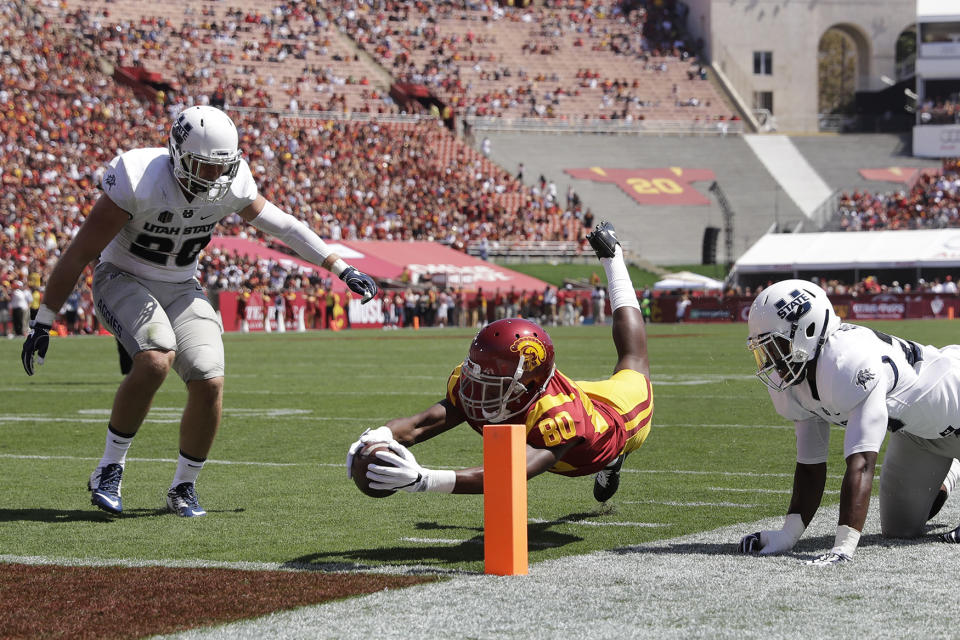 Dives into the end zone for score