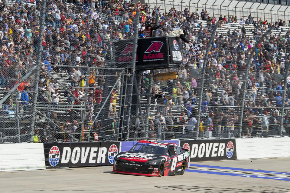 Josh Berry (8) takes the checkered flag to win the NASCAR Xfinity Series auto race at Dover International Speedway, Saturday, April 30, 2022, in Dover, Del. (AP Photo/Jason Minto)