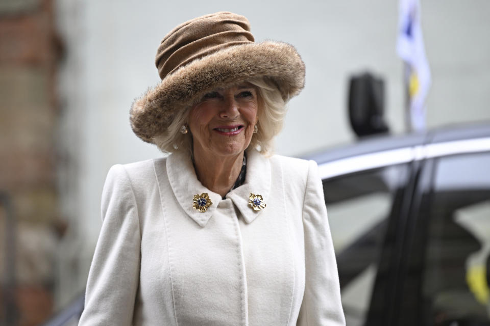 Britain's Queen Camilla smiles as she arrives for the Royal Maundy Service where she distributes the Maundy money to 75 men and 75 women, mirroring the age of the monarch, in Worcester Cathedral, Worcester, England, Thursday, March 28, 2024 to thank them for their outstanding Christian service and for making a difference to the lives of people in their local communities. Maundy Thursday is the Christian holy day falling on the Thursday before Easter. The monarch commemorates Maundy by offering 'alms' to senior citizens. Each recipient receives two purses, one red and one white. (Justin Tallis, Pool Photo via AP)