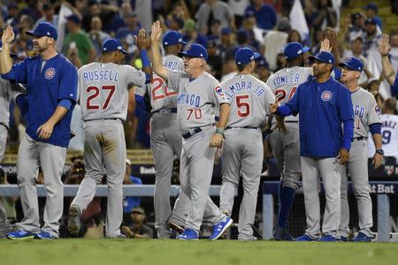 Oct 20, 2016; Los Angeles, CA, USA; Chicago Cubs celebrate defeating the Los Angeles Dodgers 8-4 in game five of the 2016 NLCS playoff baseball series at Dodger Stadium. Mandatory Credit: Richard Mackson-USA TODAY Sports