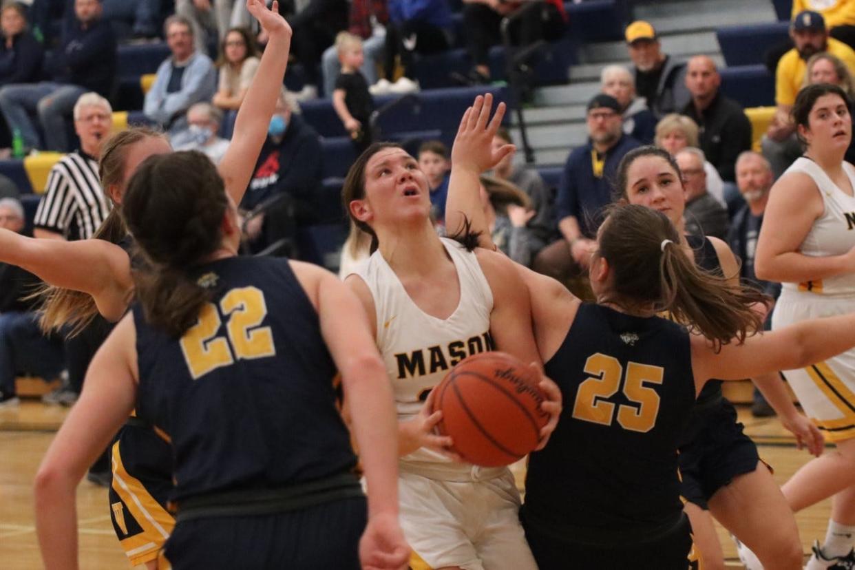 Erie Mason’s Lizzy Liedel looks for a shot between Whiteford defenders earlier this season.