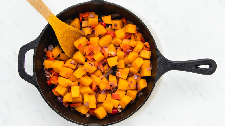 Butternut squash, pepper and onion in skillet