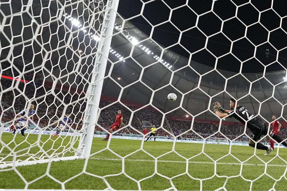 Japan's Ritsu Doan scores his side's opening goal during the World Cup group E soccer match between Japan and Spain, at the Khalifa International Stadium in Doha, Qatar, Thursday, Dec. 1, 2022. (AP Photo/Darko Vojinovic)