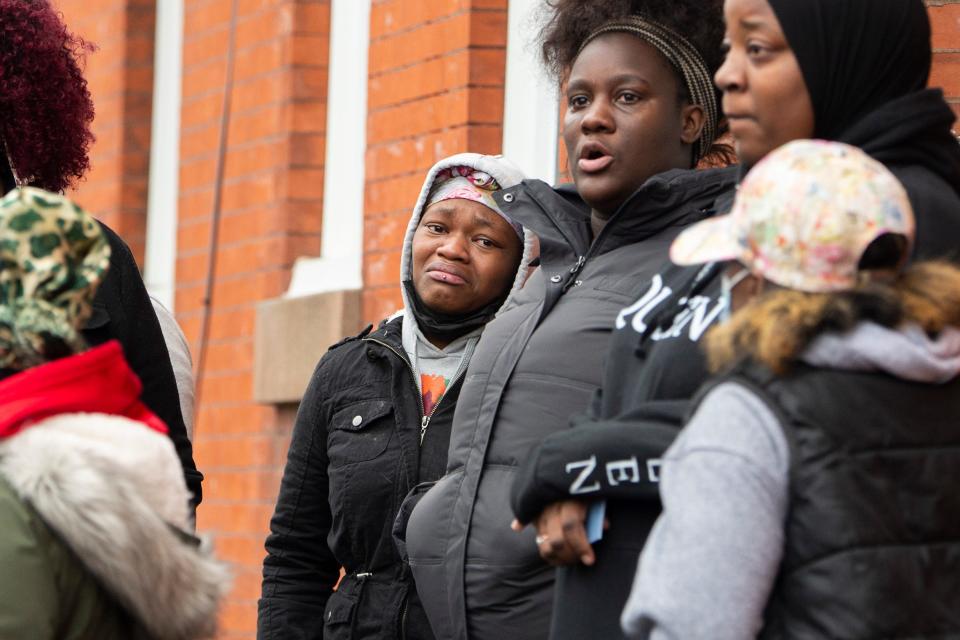 Witnesses of the aftermath react following a fatal fire on the 800 block of N. 23rd Street in Philadelphia, Pa. on Wednesday, Jan. 5, 2022.