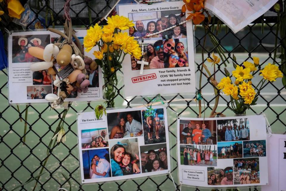 Photos of the Guara family are posted on the fence of the makeshift memorial of the victims of Champlain Towers South partial collapse. The family of four -- Marcus Guara, Anaely Rodriguez and their daughters, Lucia, 10, and Emma, 4 -- died in the condo collapse in Surfside.