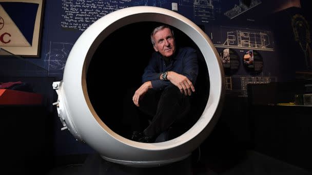 PHOTO: In this May 28, 2018, file photo, deep-sea explorer and Academy Award-winning filmmaker James Cameron sits in a scale model of the Deepsea Challenger's pilot chamber at an exhibition about his history-making deep-sea expeditions, in Sydney. (Saeed Khan/AFP via Getty Images, FILE)