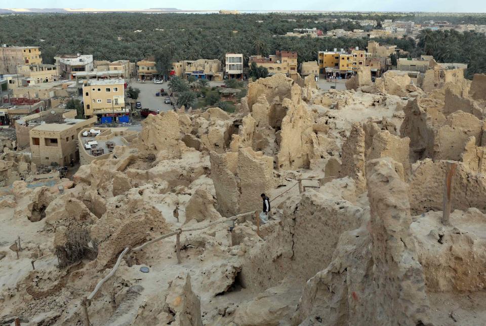 A boy walks down the ruins of the old city of 'Shali', in Siwa