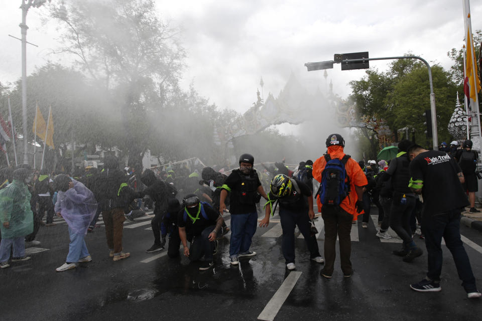 Police use water cannon to disperse protesters marching to Government House in Bangkok, Thailand Sunday, July 18, 2021. Hundreds of anti-government protesters rallied on Sunday despite the government’s recent measures to prohibit the gathering of more than 5 people in the capital to curb the COVID-19 pandemic. Protesters demanded the resignation of Prime Minister Prayuth Chan-ocha and his cabinet. (AP Photo/Anuthep Cheysakron)