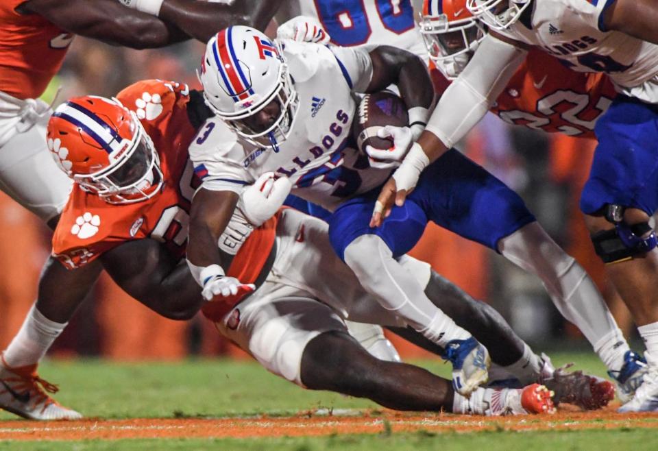 Clemson defensive tackle Ruke Orhorhoro (33) tackles Louisiana Tech Bulldogs running back Marquis Crosby (33) during the second quarter at Memorial Stadium in Clemson, South Carolina Saturday, September 17, 2022.  