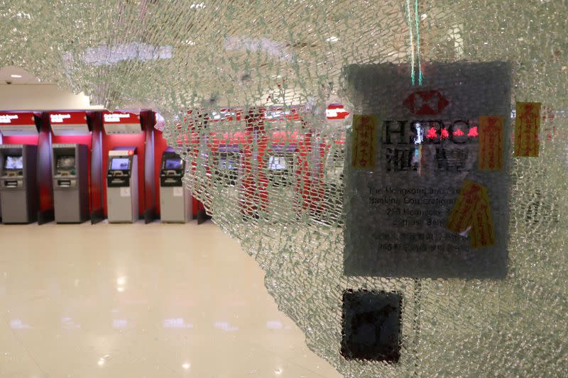 Vandalized automated teller machines (ATMs) are seen at a HSBC bank branch in Wan Chai during demonstrations on the New Year's Day in Hong Kong