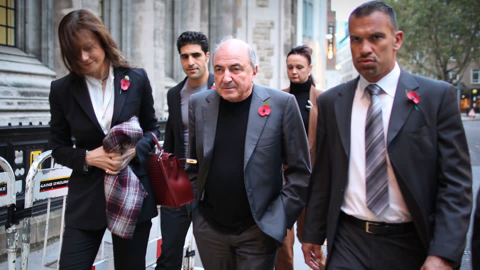 Boris Berezovsky leaves London's High Court with his partner Yelena Gorbunova, left, in 2011. - Peter Macdiarmid/Getty Images