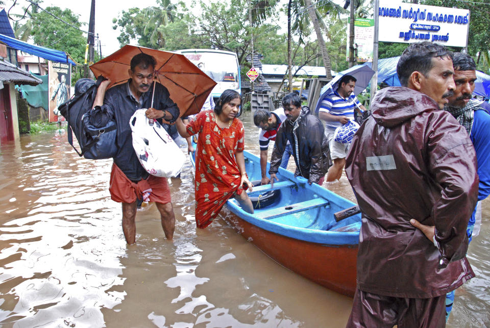 Flood victims are evacuated to safer areas in Kozhikode, in the southern Indian state of Kerala, Thursday, Aug. 16, 2018. Torrential monsoon rains have disrupted air and train services in the southern Indian state of Kerala, where flooding, landslides and bridge collapses have killed dozens of people in the past week, officials said. (AP Photo/K. Shijith)