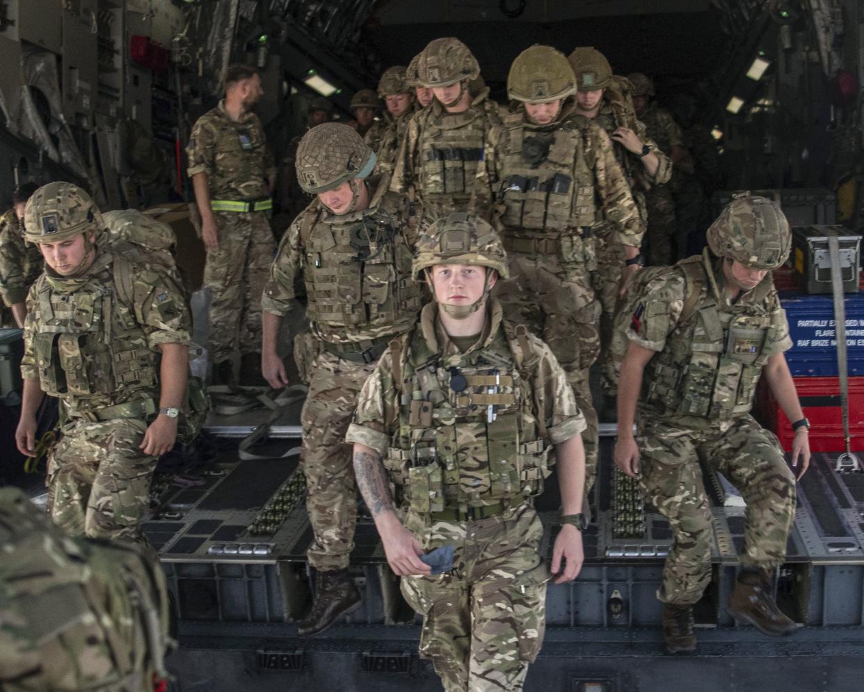 In this photo provided by the Ministry of Defence on Sunday, Aug. 15, 2021, members of the 16 Air Assault Brigade arrive in Kabul as part of a 600-strong UK force sent to assist with Operation PITTING to rescue British nationals in Afghanistan amidst the worsening security situation there.
