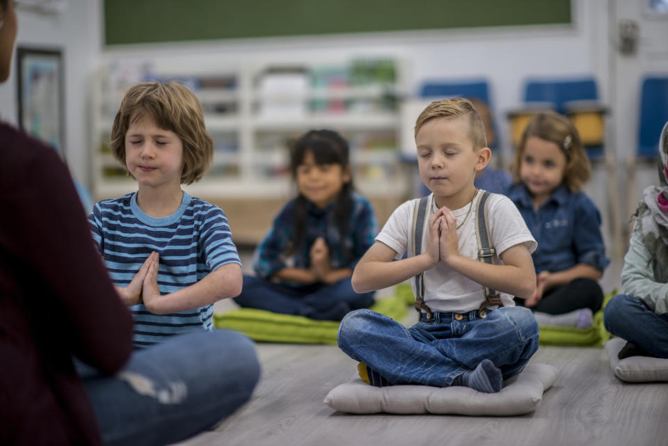 Children in hundreds of schools will be taking part in mindfulness and meditation classes [Photo: Getty]