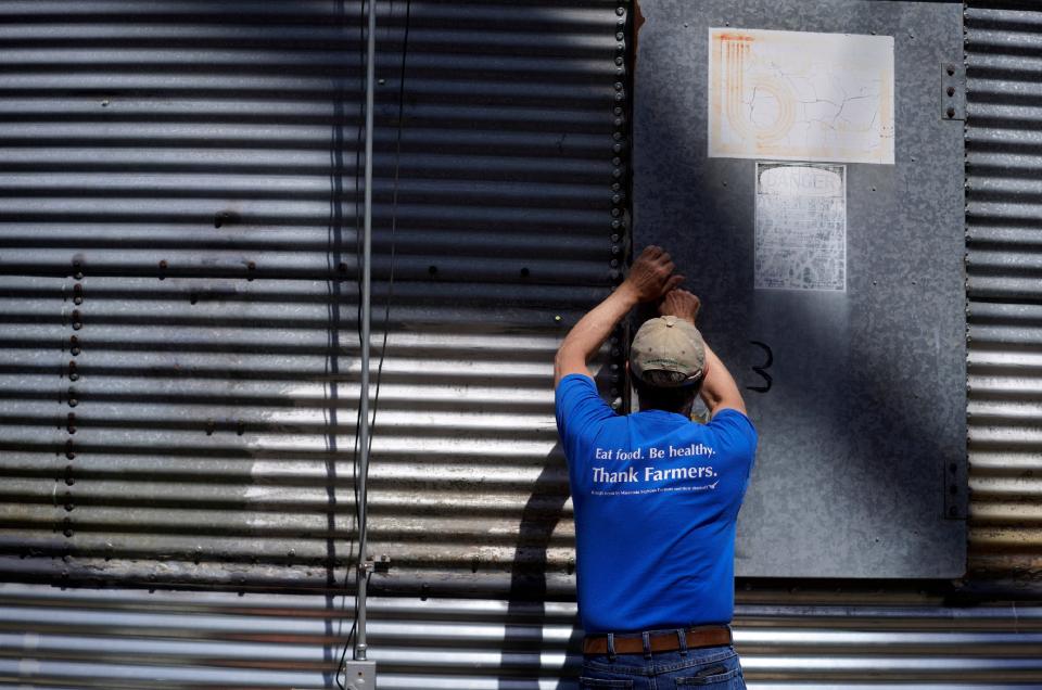 Hog and crop farmer, Scott Singlestad, closes a corn silo on his family's farm in Waseca, Minn., on Thursday, May 4, 2023. (AP Photo/Jessie Wardarski)