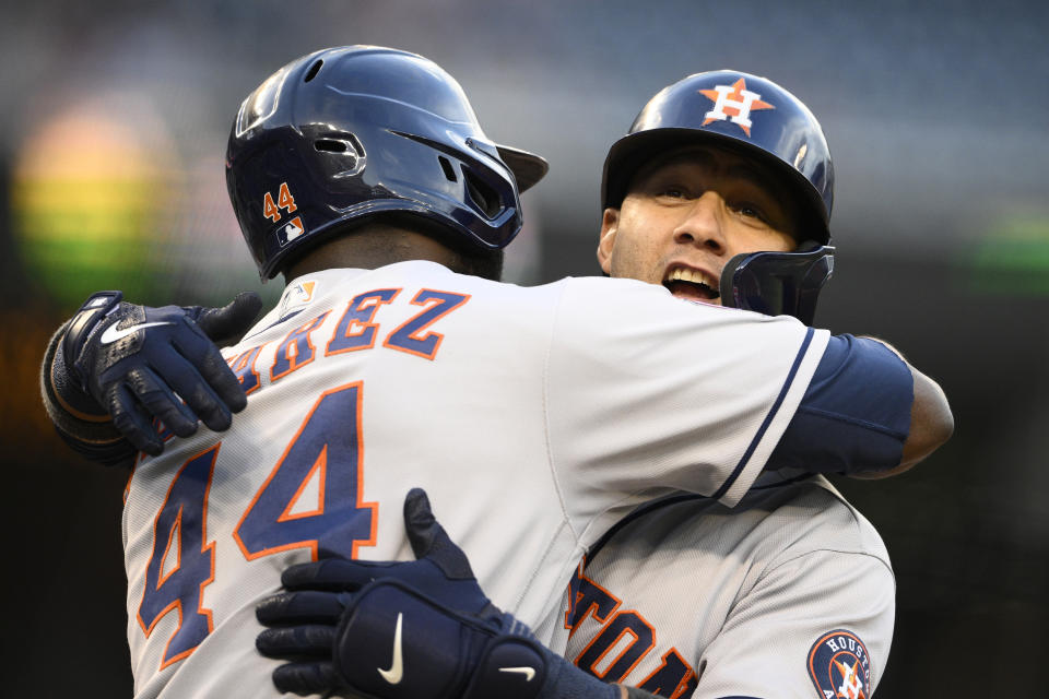 Houston Astros' Yuli Gurriel, right, celebrates after his two-run home run with Yordan Alvarez (44) during the first inning of a baseball game against the Washington Nationals, Friday, May 13, 2022, in Washington. (AP Photo/Nick Wass)