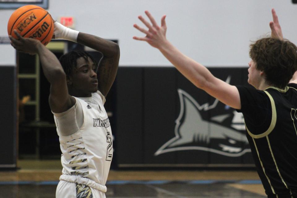 Oakleaf guard Aaron Rivers (2) aims a pass against Nease.