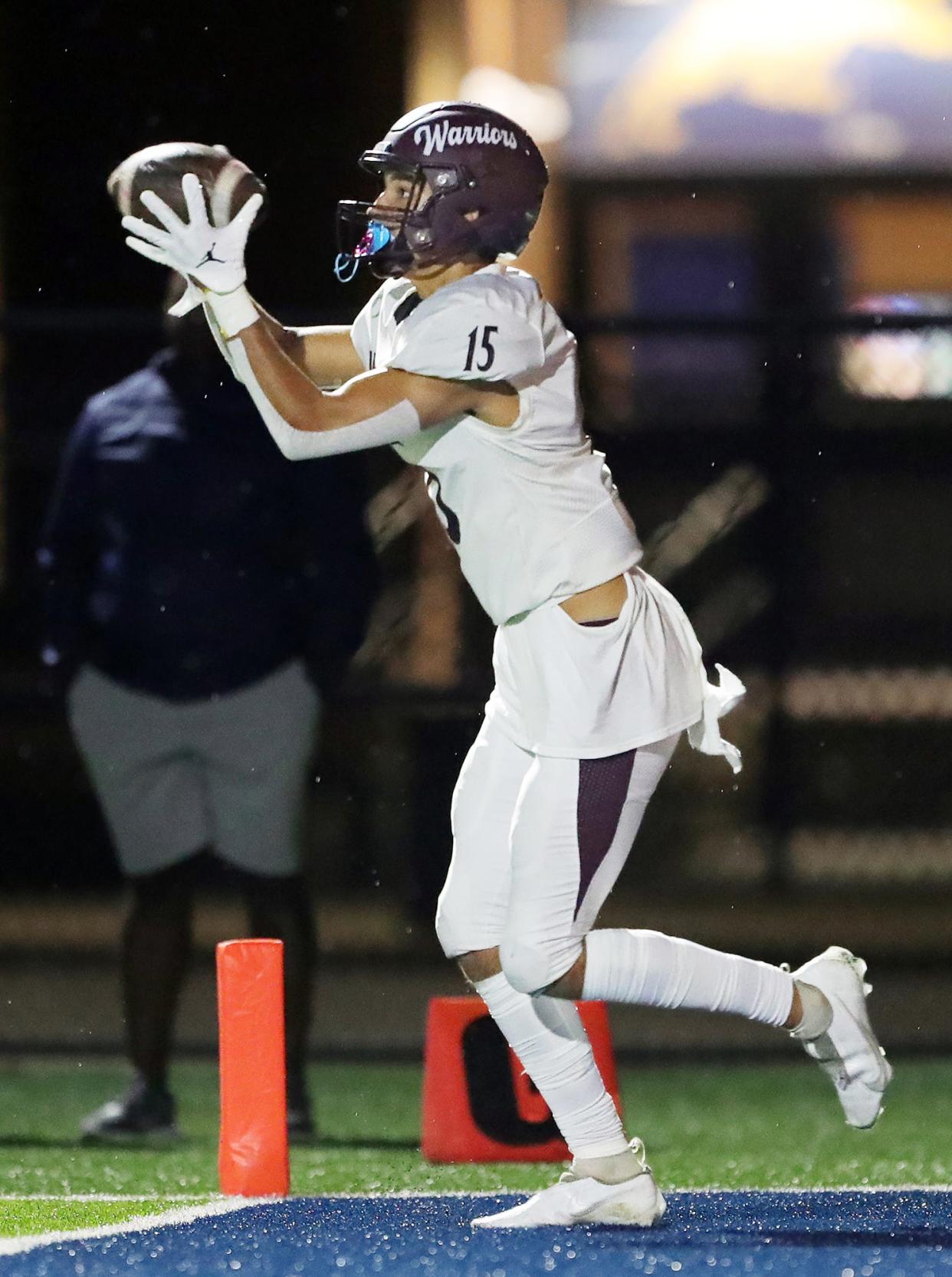 Walsh Jesuit wide receiver Owen Feliciano scores the game-winning touchdown during an overtime period of a high school football game against Benedictine, Saturday, Aug. 20, 2022, in Euclid, Ohio.