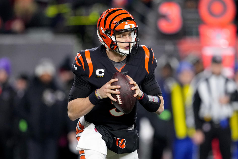 CINCINNATI, OHIO - JANUARY 15: Joe Burrow #9 of the Cincinnati Bengals looks to pass against the Baltimore Ravens during the second half in the AFC Wild Card playoff game at Paycor Stadium on January 15, 2023 in Cincinnati, Ohio. (Photo by Dylan Buell/Getty Images)