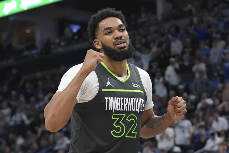 Minnesota Timberwolves center Karl-Anthony Towns reacts after a foul was called on the Timberwolves during the second half of the team's NBA basketball game against the Sacramento Kings, Friday, March 1, 2024, in Minneapolis. (AP Photo/Abbie Parr)