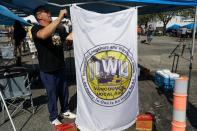 Union members with the International Longshore and Warehouse Union Canada (ILWU) gather, in Vancouver