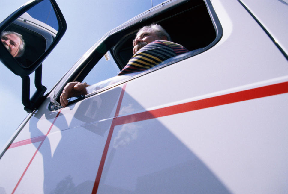 a truck driver sitting in the driver's seat