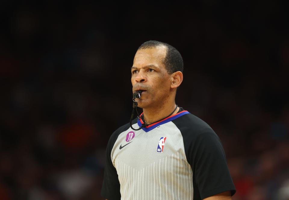 NBA referee Eric Lewis stands on the court during the Phoenix Suns game against the Minnesota Timberwolves at Footprint Center in Phoenix on March 29, 2023.