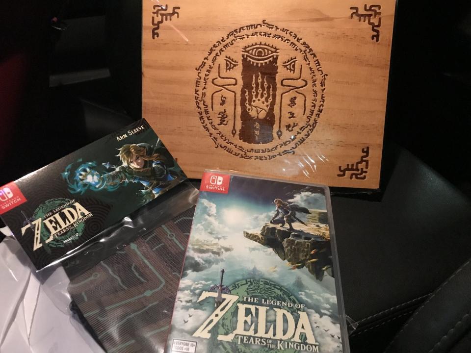 New "The Legend of Zelda: Tears of the Kingdom" video game and free items that came with the purchase and release of the game from a GameStop store in Eastpointe on May 12, 2023.