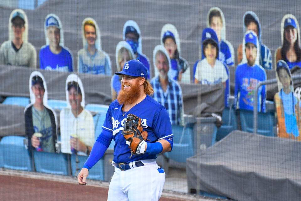 <p>Los Angeles Dodgers third baseman Justin Turner (10) warms up with the cutout of fans behind him during a MLB exhibition game between the Arizona Diamondbacks and the Los Angeles Dodgers on July 20 at Dodger Stadium in Los Angeles.</p>