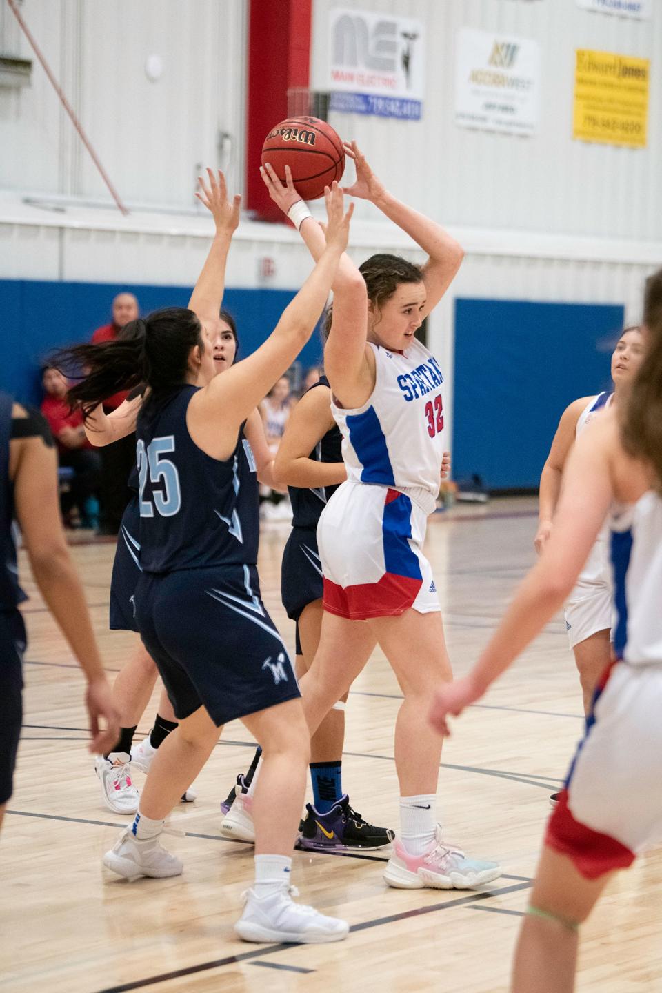 Swallows Charter Academy's Faith DeRudder fights to pass with pressure from Trinidad defenders on Friday, Dec. 16, 2022.