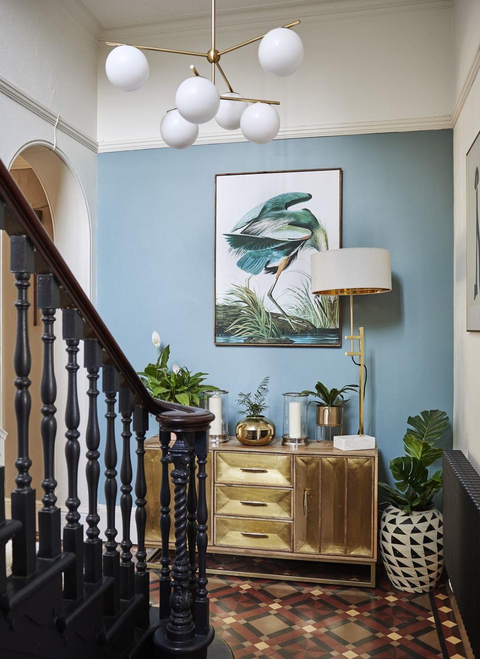 pale blue hallway with victoria tiled floor