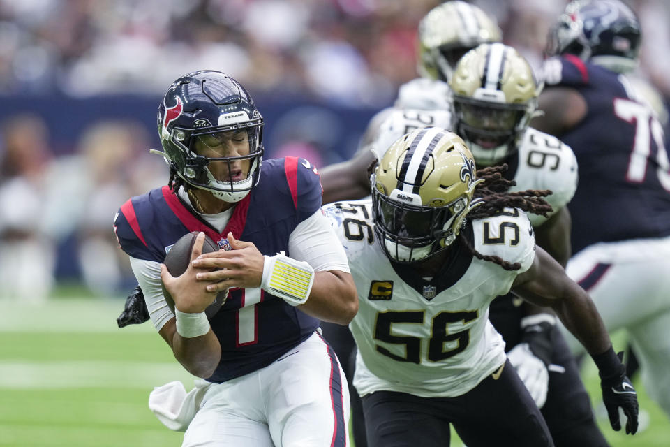 Houston Texans quarterback C.J. Stroud (7) is sacked by New Orleans Saints linebacker Demario Davis (56) in the second half of an NFL football game in Houston, Sunday, Oct. 15, 2023. (AP Photo/Eric Christian Smith)