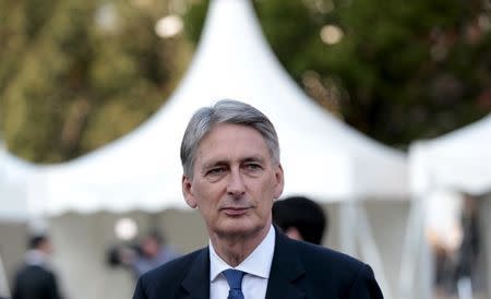 Britain's Foreign Secretary Philip Hammond leaves following a televised interview outside the conference hall at the Conservative Party Conference in Manchester, Britain October 4, 2015. REUTERS/Suzanne Plunkett
