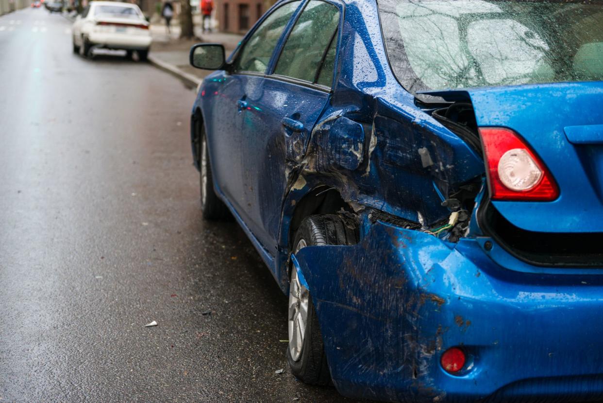 Hit and run involving a parked car on a city street.